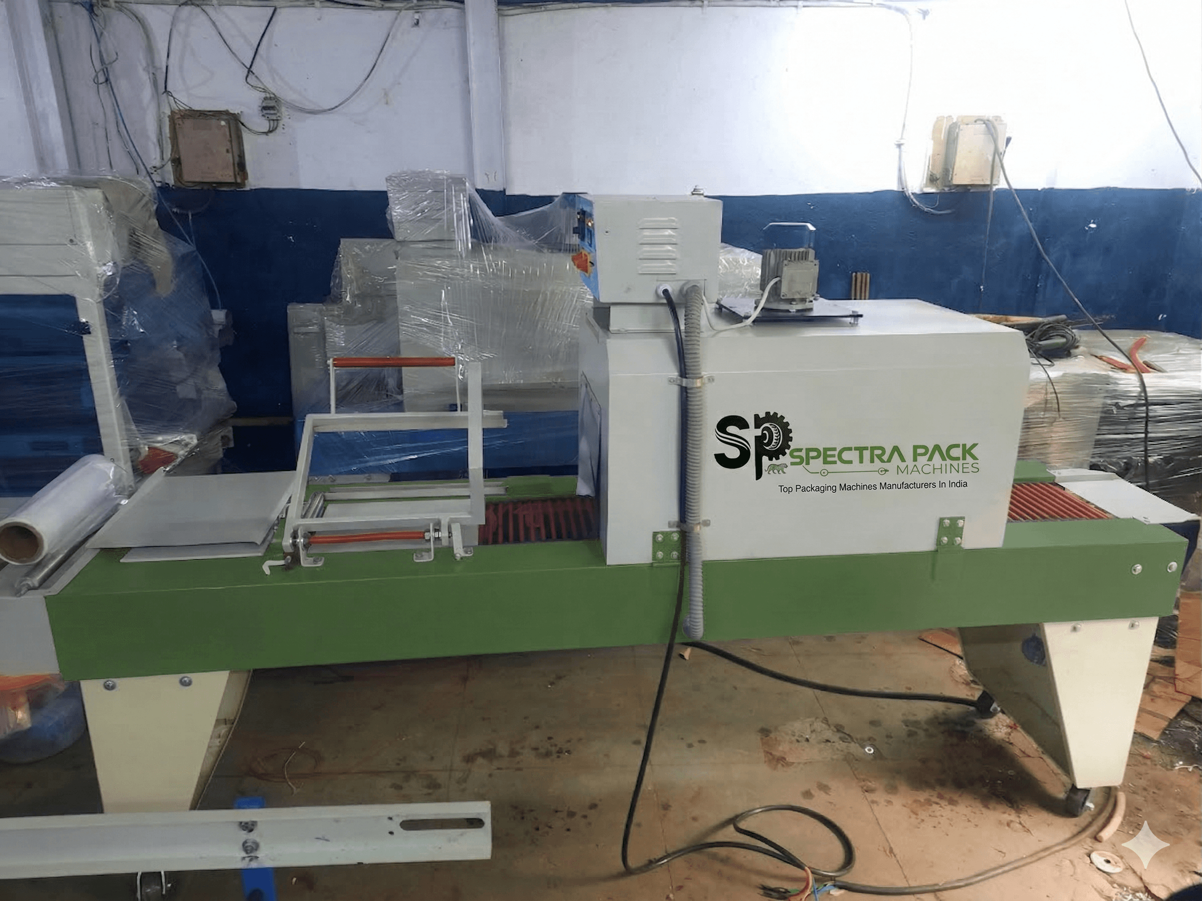 L-Sealer with shrink tunnel machine by Spectra Pack Machines